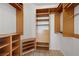 Spacious walk-in closet with custom shelving and drawers for optimal storage at 2260 Village Walk Dr # 1305, Henderson, NV 89052