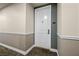 Apartment 1305 front door displaying a modern design with neutral colors and a visible unit number at 2260 Village Walk Dr # 1305, Henderson, NV 89052