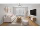Bright and inviting living room with a bay window, modern decor, and a cozy seating arrangement at 2260 Village Walk Dr # 1305, Henderson, NV 89052