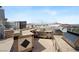 Inviting rooftop outdoor kitchen with granite countertops and built-in stainless steel appliances at 2260 Village Walk Dr # 1305, Henderson, NV 89052