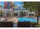Inviting outdoor retail area with comfortable seating, palm trees, and a splash fountain at 2260 Village Walk Dr # 1305, Henderson, NV 89052