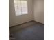 An inviting bedroom with natural light, neutral walls, and cozy carpet flooring at 230 Mission Catalina Ln # 204, Las Vegas, NV 89107
