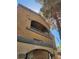 Exterior view of a condo unit with a private balcony and traditional architecture at 230 Mission Catalina Ln # 204, Las Vegas, NV 89107