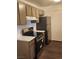 Efficient kitchen featuring modern appliances, sleek countertops, and ample cabinet space at 230 Mission Catalina Ln # 204, Las Vegas, NV 89107