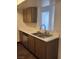 A double-basin kitchen sink with updated faucet fixtures and stylish countertops at 230 Mission Catalina Ln # 204, Las Vegas, NV 89107