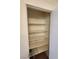 A neatly organized linen closet with shelving, providing convenient storage solutions at 230 Mission Catalina Ln # 204, Las Vegas, NV 89107