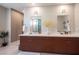 Bathroom featuring a vanity, dual sinks, and a glass shower enclosure at 2510 Verdello St, Henderson, NV 89044