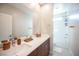 Modern bathroom with double vanity, neutral walls, and tub/shower combo, offering a clean and functional design at 2510 Verdello St, Henderson, NV 89044