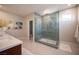 A modern bathroom featuring beautiful tile work and a glass shower at 2510 Verdello St, Henderson, NV 89044