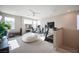 Bright bonus room features home gym setup with weights, treadmill, and comfortable seating, perfect for fitness and relaxation at 2510 Verdello St, Henderson, NV 89044