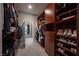 A walk-in closet with custom shelving, drawers, and clothing racks at 2510 Verdello St, Henderson, NV 89044