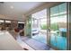 Indoor outdoor living showcasing a covered patio and outdoor dining area, accessed via sliding glass doors from the kitchen at 2510 Verdello St, Henderson, NV 89044