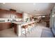 Modern kitchen features stainless steel appliances, a large island with seating, and plenty of cabinet space at 2510 Verdello St, Henderson, NV 89044