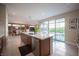 Beautiful kitchen with stainless steel appliances and a view of the outdoor patio through sliding glass doors at 2510 Verdello St, Henderson, NV 89044