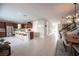 Bright, open-concept kitchen featuring a large island, stainless steel appliances, and adjacent dining area at 2510 Verdello St, Henderson, NV 89044