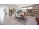 Open floor plan features a modern dining area, staircase, and accent wall at 2510 Verdello St, Henderson, NV 89044