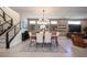 Open floor plan features a modern dining area, staircase, and accent wall at 2510 Verdello St, Henderson, NV 89044
