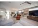 Bright, open living space with accent wall, modern dining area, and view to the front door at 2510 Verdello St, Henderson, NV 89044