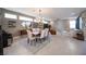 Open floor plan features a modern dining area and a brick accent wall at 2510 Verdello St, Henderson, NV 89044