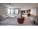 Bright, open living space features a large sectional sofa and view to the kitchen at 2510 Verdello St, Henderson, NV 89044