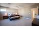 Main bedroom featuring decorative wallpaper, ceiling fan and lots of light at 2510 Verdello St, Henderson, NV 89044