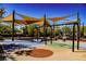 Community playground with swings and sunshades providing a fun outdoor recreation space for families at 2510 Verdello St, Henderson, NV 89044