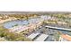 Commercial space by a lake with a parking lot, stores, and palm trees at 2608 Sun Reef Rd, Las Vegas, NV 89128