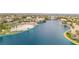 Gorgeous aerial view of community featuring waterfront property, beach access, and beautiful mature landscaping at 2608 Sun Reef Rd, Las Vegas, NV 89128