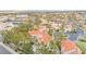 Neighborhood overview featuring homes, streets, mature trees and a lake at 2608 Sun Reef Rd, Las Vegas, NV 89128