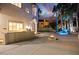 Backyard oasis with a firepit, waterfall feature and built in BBQ area at 2608 Sun Reef Rd, Las Vegas, NV 89128