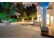 Backyard at twilight with ambient lighting, fire pit, and outdoor kitchen area at 2608 Sun Reef Rd, Las Vegas, NV 89128