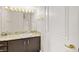 Bathroom vanity with granite counters, wood cabinets, and gold hardware at 2608 Sun Reef Rd, Las Vegas, NV 89128