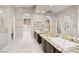Spacious primary bathroom featuring dual sinks, granite counters, and a walk-in shower at 2608 Sun Reef Rd, Las Vegas, NV 89128