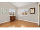 Comfortable bedroom with hardwood flooring and shuttered windows at 2608 Sun Reef Rd, Las Vegas, NV 89128