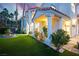 Beautiful home featuring well-manicured lawn, lush landscaping, and stately columns at 2608 Sun Reef Rd, Las Vegas, NV 89128