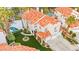 Aerial view of a home with a red tile roof, lush landscaping, and a private pool at 2608 Sun Reef Rd, Las Vegas, NV 89128