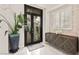 Elegant foyer featuring a decorative front door, stylish console, and designer finishes at 2608 Sun Reef Rd, Las Vegas, NV 89128
