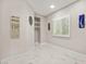 Hallway with window, built-in shelves, and modern accents at 2608 Sun Reef Rd, Las Vegas, NV 89128