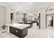 Open concept kitchen with large island, marble floors, modern appliances, and sleek cabinetry at 2608 Sun Reef Rd, Las Vegas, NV 89128