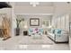 Bright living room boasts high ceilings, neutral decor, large windows and stylish modern furniture at 2608 Sun Reef Rd, Las Vegas, NV 89128