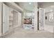 Bright living room with fireplace and access to other rooms at 2608 Sun Reef Rd, Las Vegas, NV 89128