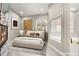 Cozy main bedroom with a fireplace, calming colors and a spa-like en suite bathroom at 2608 Sun Reef Rd, Las Vegas, NV 89128