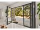 Indoor outdoor space featuring a patio with a view of tall palm trees at 2608 Sun Reef Rd, Las Vegas, NV 89128