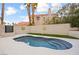 Modern pool with elegant steps, serene blue water, and well-maintained yard at 2608 Sun Reef Rd, Las Vegas, NV 89128