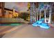 Backyard with pool, waterfall feature and tropical landscaping providing a private outdoor escape at 2608 Sun Reef Rd, Las Vegas, NV 89128