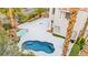 Aerial view of a backyard with a swimming pool, hot tub, and a patio area at 2608 Sun Reef Rd, Las Vegas, NV 89128