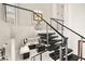 Modern staircase overlooks kitchen with island and leads to the upper level at 2608 Sun Reef Rd, Las Vegas, NV 89128