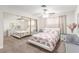 Bright bedroom with floral bedding, mirrored closet, and modern dresser with decor at 2645 Heritage Ct, Las Vegas, NV 89121