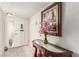Bright entryway with tiled floors, console table, and sidelight window by the front door at 2645 Heritage Ct, Las Vegas, NV 89121