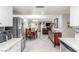 Open-concept living room showcasing seamless flow from kitchen to dining area with comfortable seating at 2645 Heritage Ct, Las Vegas, NV 89121